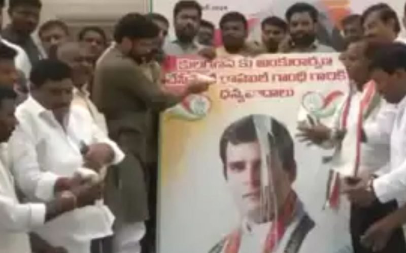 Telangana Congress workers offer milk to Rahul Gandhis poster
