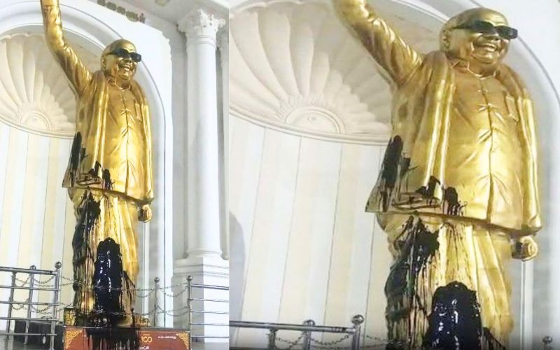 black paint being thrown on Karunanidhi's statue in Salem